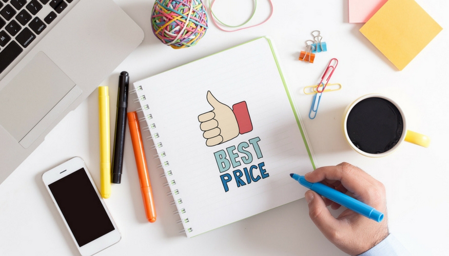 notebook on top of the desk with a writing that says "best price"